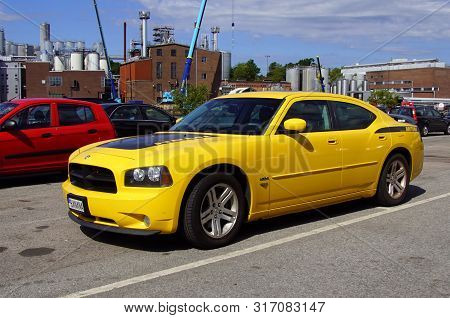 Karlshamn, Sweden - July 26, 2019: Yellow Dodge Charger Hemi Daytona Parked On A Public Parking Lot.