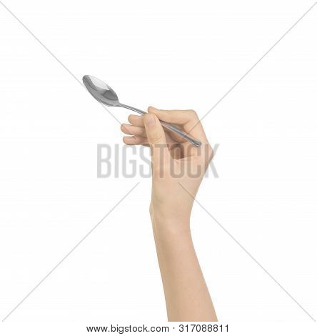 Silver Spoon In Women Hand Isolatedon White Background,