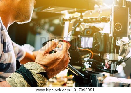 Film Industry. Cameraman Shooting Film Scene With Camera