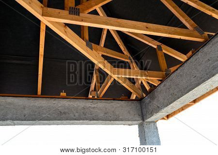 Roof Trusses Covered With A Membrane On A Detached House Under Construction, Visible Roof Elements, 