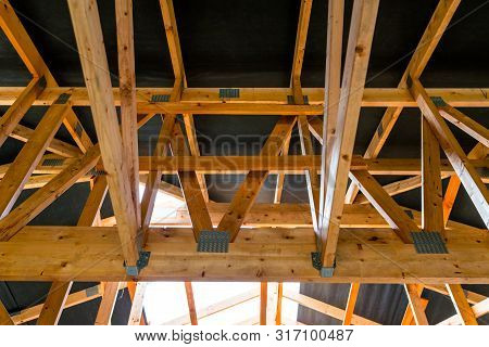 Roof Trusses Covered With A Membrane On A Detached House Under Construction, Visible Roof Elements, 