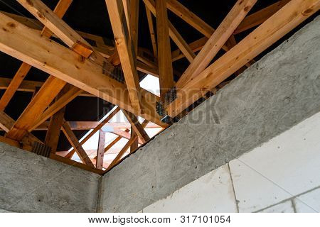 Roof Trusses Covered With A Membrane On A Detached House Under Construction, Visible Roof Elements, 