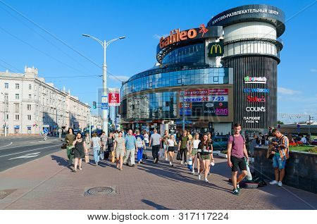 Minsk, Belarus - August 17, 2018: Unidentified People Go On Street Near Popular Large Shopping And E