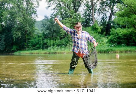 Pensioner Leisure. Man Senior Bearded Fisherman. Hobby Sport Activity. Fish Farming Pisciculture Rai