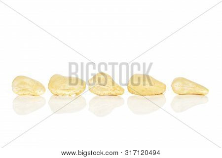 Group Of Five Whole Unsalted Beige Cashew Isolated On White Background