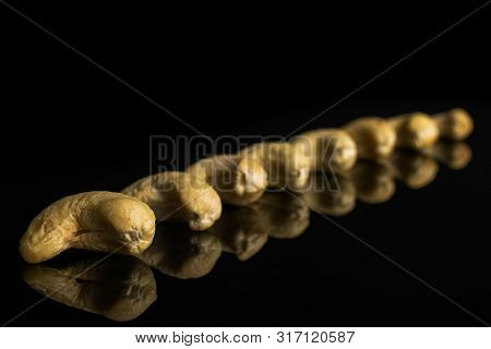 Lot Of Whole Unsalted Beige Cashew Isolated On Black Glass