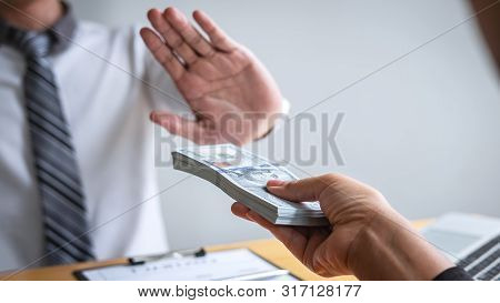 Anti Bribery And Corruption Concept, Business Man Refusing And Don't Receive Money Banknote In Envel