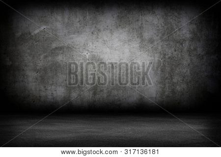 Grunge interior room with concrete wall and floor. Empty concrete space.