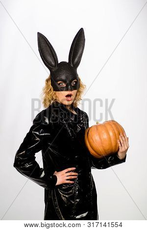 Sexy Blonde Girl In Rabbit Black Mask With Pumpkin. Sexy Female Model In Easter Bunny Black Rabbit M