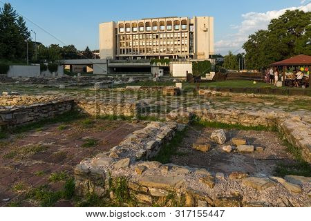 Stara Zagora, Bulgaria - August 5, 2018: Sunset View Of Regional Library And Ruins Of Ancient August