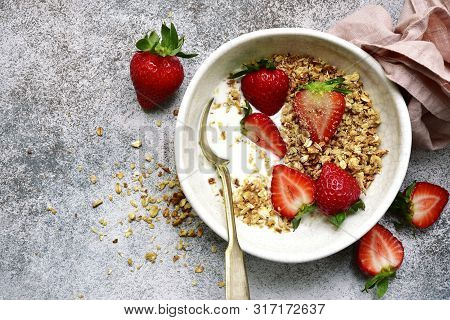 Homemade Multicereal Granola With Yogurt And Fresh Strawberry For A Breakfast.top View With Copy Spo