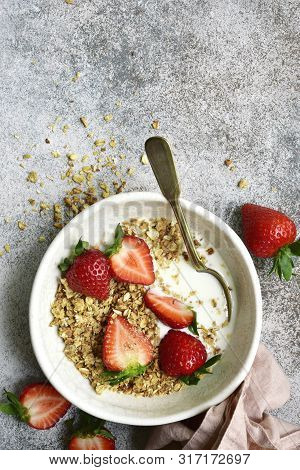 Homemade Multicereal Granola With Yogurt And Fresh Strawberry For A Breakfast.top View With Copy Spo