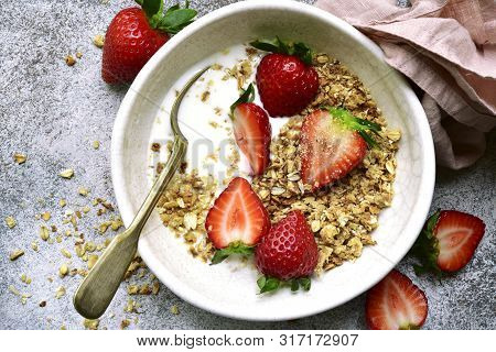 Homemade Multicereal Granola With Yogurt And Fresh Strawberry For A Breakfast.top View With Copy Spo