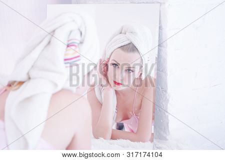 Attractive Young Woman Wrapped With Bath Towel After A Shower At The Bathroom.