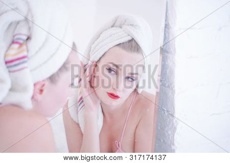 Attractive Young Woman Wrapped With Bath Towel After A Shower At The Bathroom.
