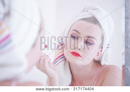 Attractive Young Woman Wrapped With Bath Towel After A Shower At The Bathroom.