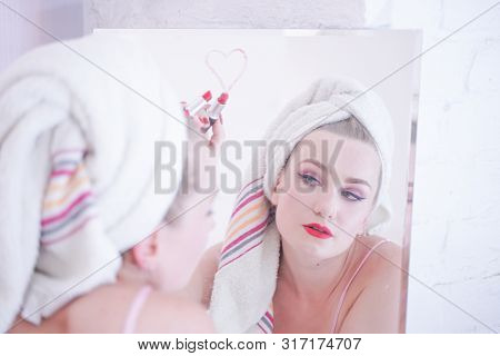 Attractive Young Woman Wrapped With Bath Towel After A Shower At The Bathroom.