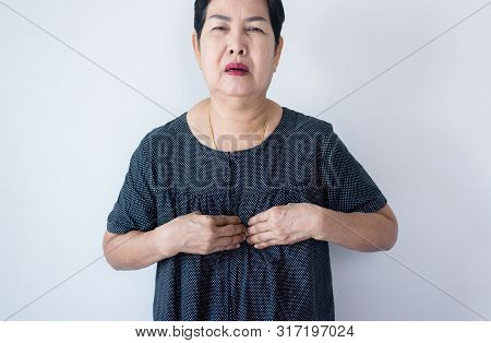 Senior Asian Woman Having Or Symptomatic Reflux Acids,gastroesophageal Reflux Disease,copy Space On 
