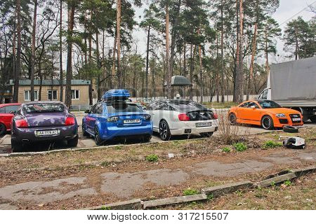April 3, 2015. Ukraine, Kiev. Super Combo Of Supercars. Purple And White Bentley And Blue Audi Rs4 A