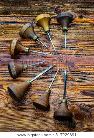 Different Gravers For Jewelry On A Wooden Background