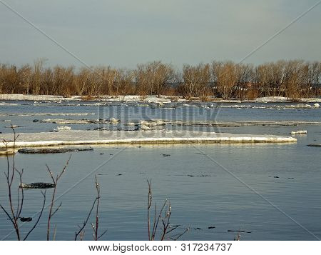 Melting Snow In The Spring. The Spring Heat Will Melt The Snow. Brooks And Streams Of Melt Water