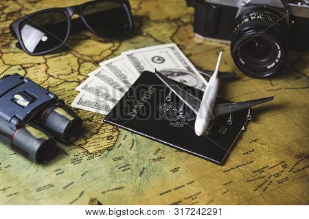 Tourist Planning Props And Travel Accessories With American Passport, Airplane, Digital Camera, Tele