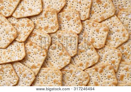 Tuc Original Snack Crackers Lies On Market Table Stacked In Big Pile