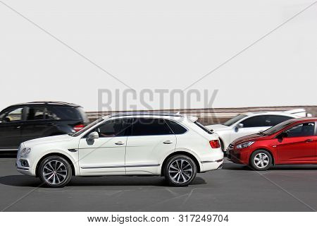 Kiev, Ua - May 3, 2017: Bentley Bentayga. White English Suv Bentley Bentayga In Motion