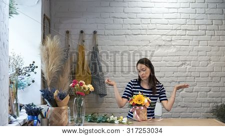 Portrait Of Woman Creating Flower Compositions..