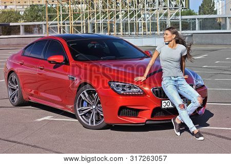 September 17, 2014, Kiev, Ukraine. Fashionable Brunette Near The Car Bmw M6