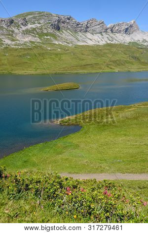 View At Lake Tannensee Over Engelberg In The Swiss Alps