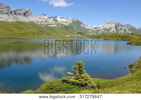 View At Lake Tannensee Over Engelberg In The Swiss Alps