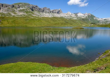 View At Lake Tannensee Over Engelberg In The Swiss Alps