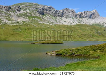 View At Lake Tannensee Over Engelberg In The Swiss Alps