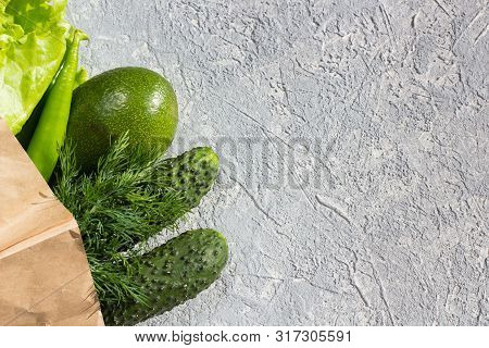 Juicy Greens In A Eko Bag On A Gray Background