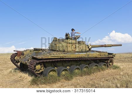 Taman, Temryuk District, Krasnodar Region, Russia - July 17, 2019: Boy Plays On The T-64 Tank In The