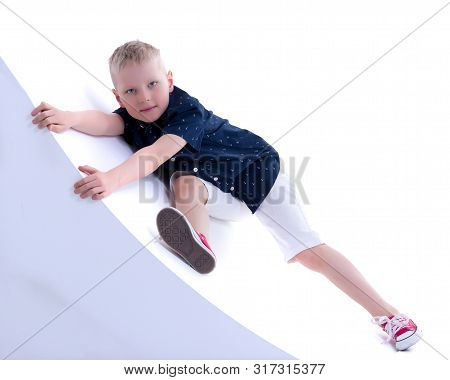 Cute Little Boy Studio Portrait On White Cyclorama. The Concept Of A Happy Childhood. Isolated On Wh