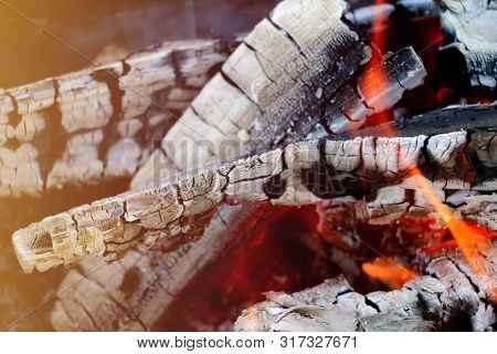 Smoldering Coals From The Fire. A Fading Bonfire. Close-up. Texture.