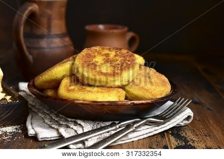 Fried Potato Patties With Cheese.