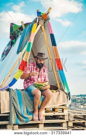 Camping And Hiking Concept. Traveling And Camping With A Tent. Travel Homemade Tent. Camping Tent On