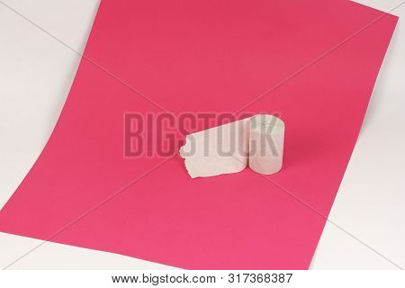 Rough Recycled White Toilet Paper On Pink Paper On White Background, Close-up, Copy Space, Concept O