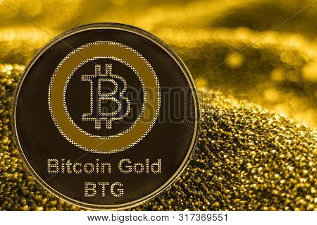 Coin Cryptocurrency Btg And Gold Fabric Background. Bitcoin Gold Logo.