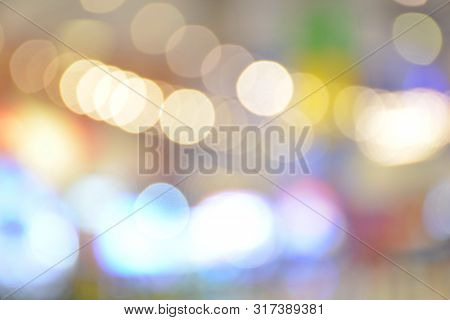 Abstract Blur Image Of Amusement Park In Shopping Mall With Boken Lights,use For Backdrop Or Web Des