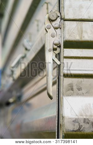 Close Up On Industrial Metal Made Handle Lock For Opening Semi Trailer