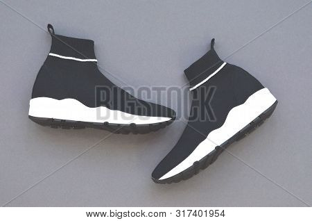 Fashionable Womens And Mens Shoes. Unisex. Beautiful Fashionable Socks Sneakers On A Gray Background