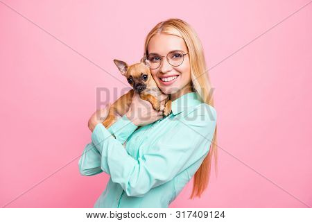 Portrait Of Charming Lady Holdinh Her Pet Looking With Beaming Smile Wearing Mint Color Shirt Isolat