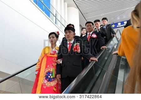 Pyongyang, North Korea - April 29, 2019: Korean Newlyweds Couple In Pyongyang International Airport