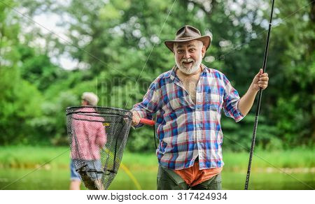 Bearded Men Catching Fish. Mature Man With Friend Fishing. Summer Vacation. Happy Cheerful People. M