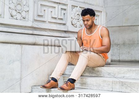 Young Mix-race American College Student Studying In New York City, Wearing Orange Tank Top, Beige Pa