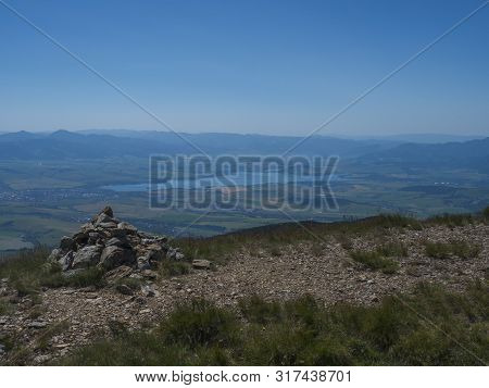 View On Valley Of Liptovsky Mikulas With Liptovska Mara Lake From Hiking Trail On Baranec Peak At We